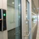 Employee using a keypad for an office access control system from a vetted installation company.