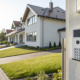 Home security alarm keypad professionally installed by a company at a modern home's entrance.