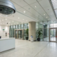 Business security camera systems monitoring the entrance of a modern office.