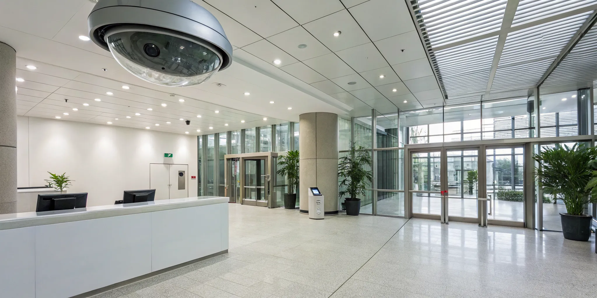 Business security camera systems monitoring the entrance of a modern office.