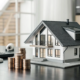 A calculator with stacked coins and a model house shows the true cost of long-term home security.