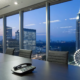 Business alarm monitoring pricing in Atlanta with a security phone on an office desk.