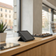 Tablet on a counter showing the benefits of cloud-based surveillance for a small business.
