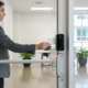 Employee using an electronic access reader at a small business entrance