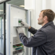 Alarm system reactivation by a professional technician on a control panel.