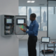 Commercial security alarm control panel in modern Atlanta office building