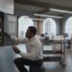 Commercial fire alarm technician inspecting a fire alarm control panel in an Atlanta office building