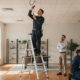 Technician inspecting a fire alarm system Woodstock businesses use