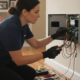 Alarm technician inspecting a security system control panel