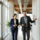 Security professional and facilities manager reviewing a commercial security system design