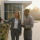 School staff reviewing controlled entry hardware at a campus entrance